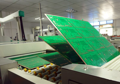 Printed circuit board loader is feeding panels into a horizontal line Printed circuit board loader is feeding panels into a horizontal line